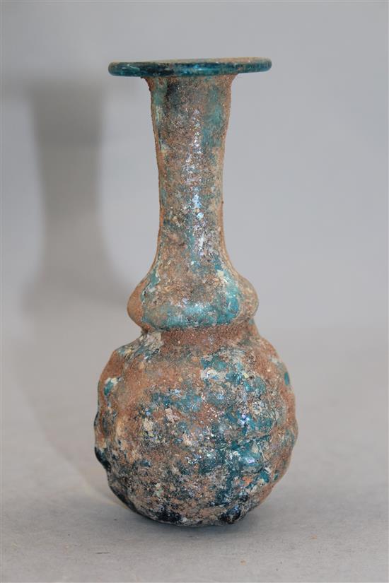 A Roman turquoise glass grape flask, Syria 1st / 2nd century AD, 13.5cm